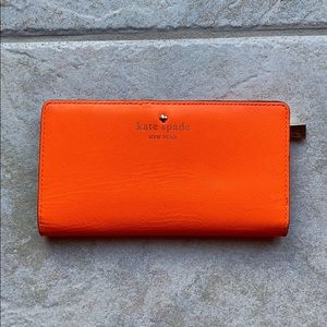 Orange bi-fold Kate Spade wallet